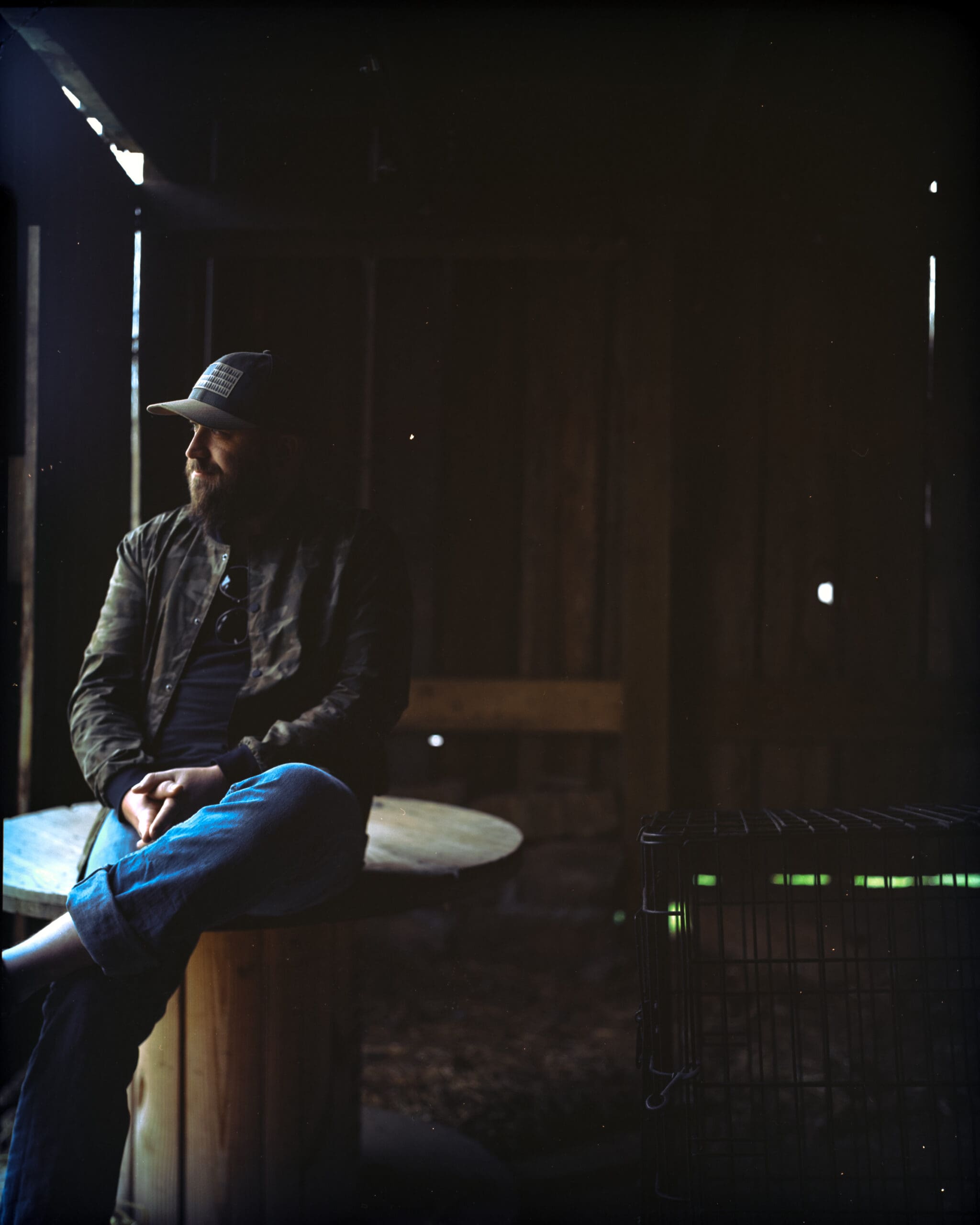 Kenneth Stevenson sitting in a barn